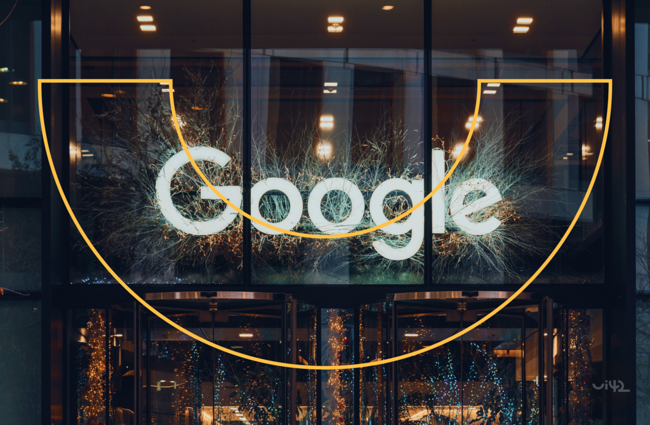 Entrance to the building with the Google logo and light decoration