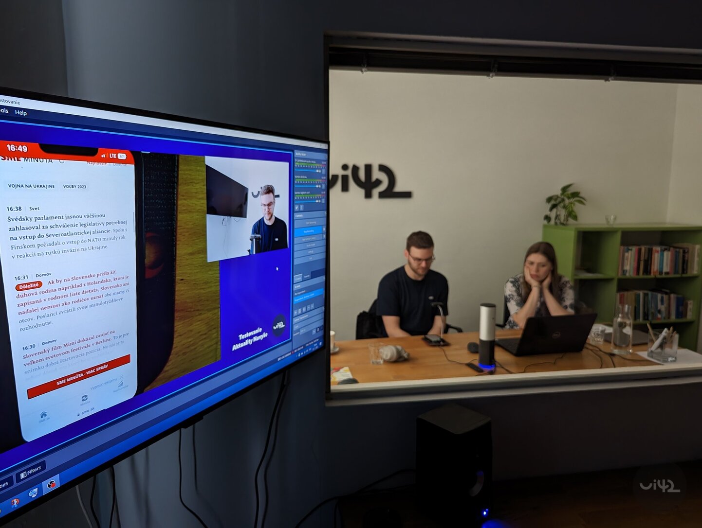 People during UX testing in the office with a monitor displaying an online test
